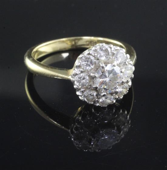 An 18ct gold and diamond cluster ring, size O.